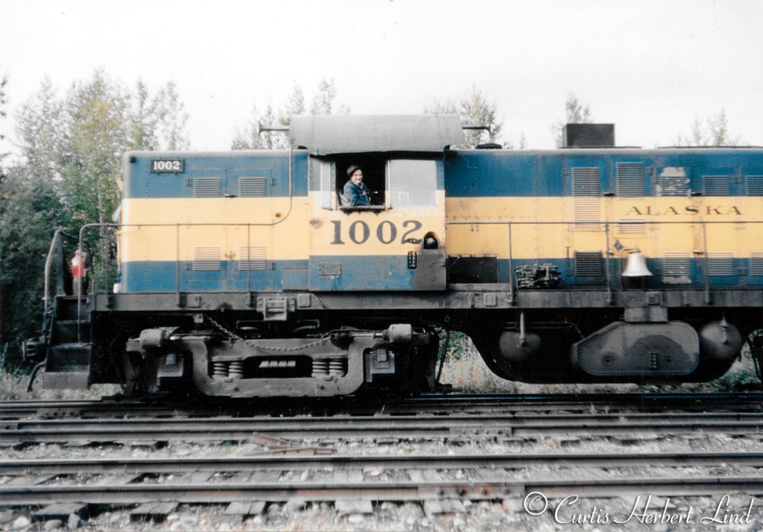 Another view of ALCO RSD1 #1002 with the 4 wheel truck conversion. Love that bell. Curt Lind is in locomotive cab.