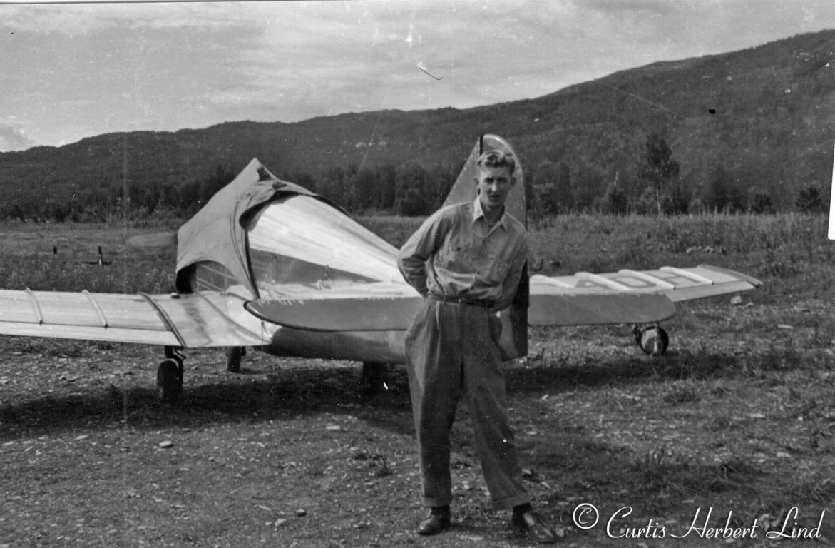 Unidentified tricycle gear airplane. Curt Lind in photo.