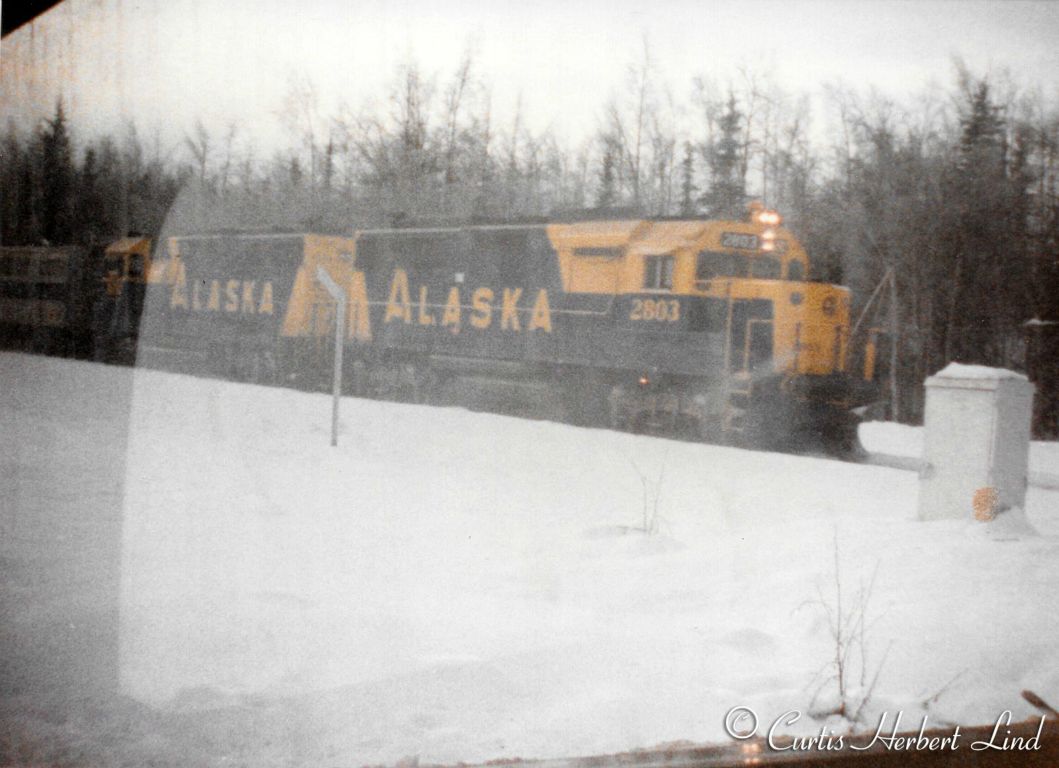 A pair of GP 49 units at a grade crossing. These 2800 HP units were new in 1983 so we can date this photo as much later that the previous shots in this collection. 