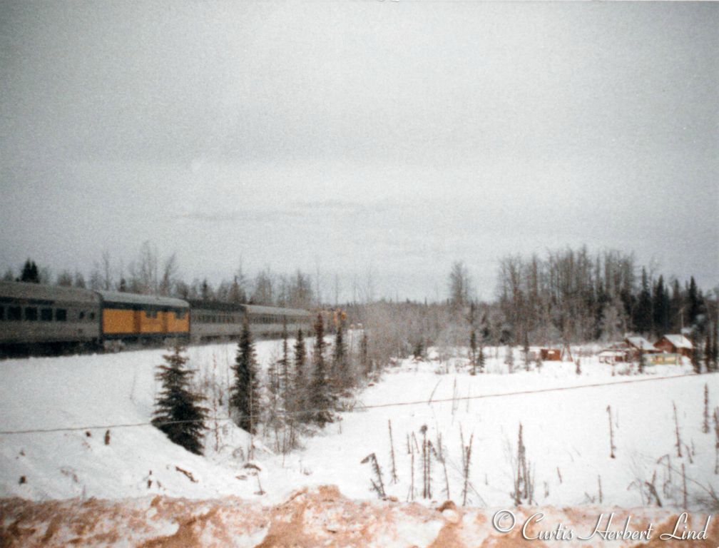 Consist behind the GP49’s (in previous photo) was a mixed bag of passenger equipment. Possibly at the Sunshine grade crossing near the Susitna River. 