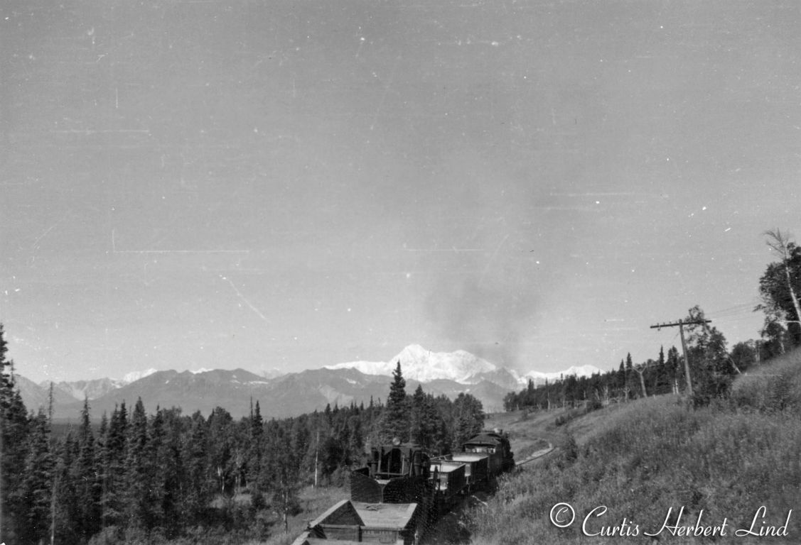 Climbing the hill from Chulitna up to Hurricane, the mountain is Denali, MP 273 to MP 277. More of the MOW ballast train and we now see there are two Jordan Spreaders, one facing each direction in the consist with a caboose at the end. The photographer was able to take photos 38,39 and 40 from the roof or control cab of the trailing Jordan Spreader. 41 is clearly taken from the top of the caboose.