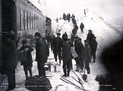 Passengers from Anchorage walking over snow