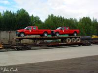 red trucks on flatcar